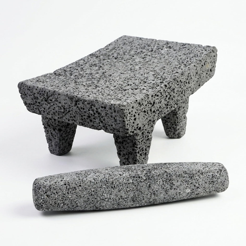 Mexican metate of volcanic rock with its mano roller stone