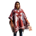 Model wearing the Red Horse hooded Mexican poncho in burgundy, front view on white