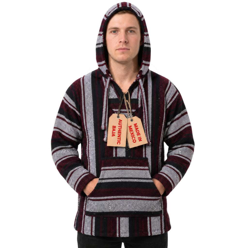 Man wearing the red and grey Mexican Baja hoodie with the hood up