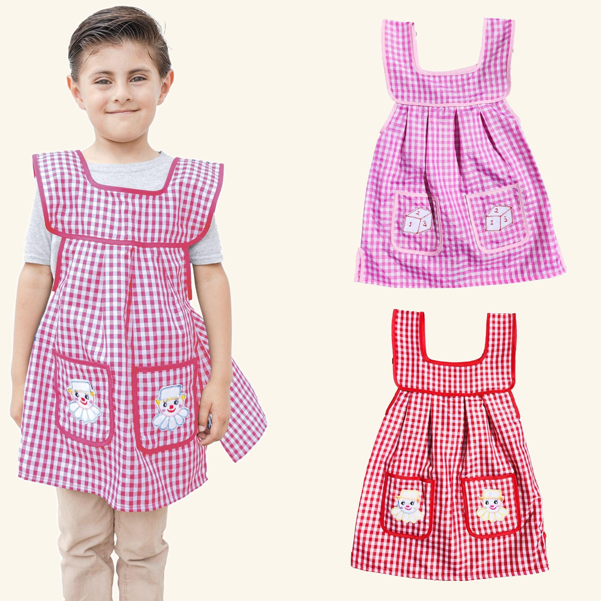 Girl wearing the pink gingham kids apron, with the pink and red aprons of the 2 pack