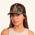 Woman wearing the Our Lady of Guadalupe embroidered cap with red roses