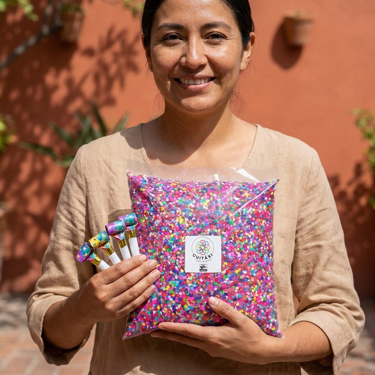Woman holding Cuitaxi Mexican confetti and party blowers