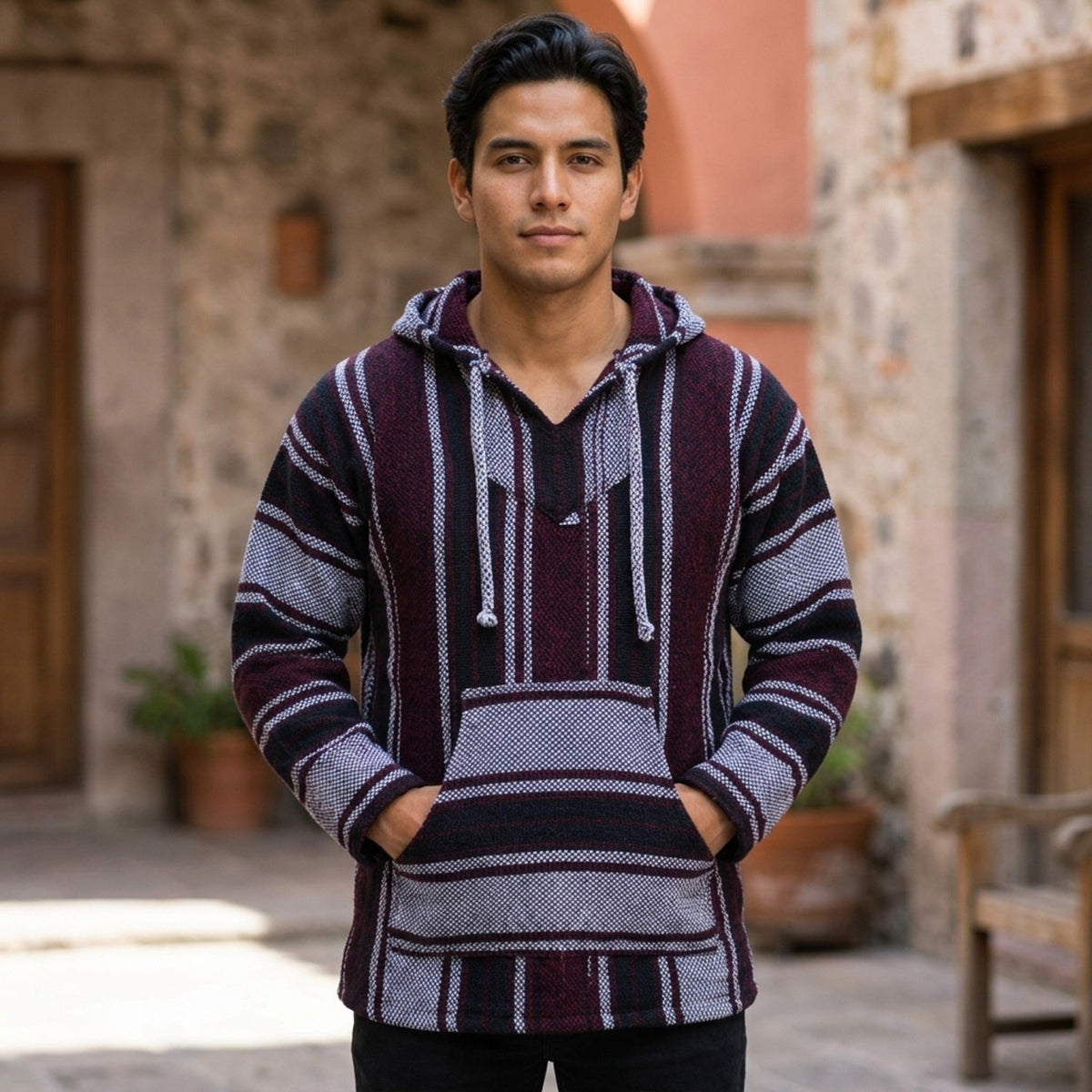 Man wearing the Mexican Baja hoodie on a stone street