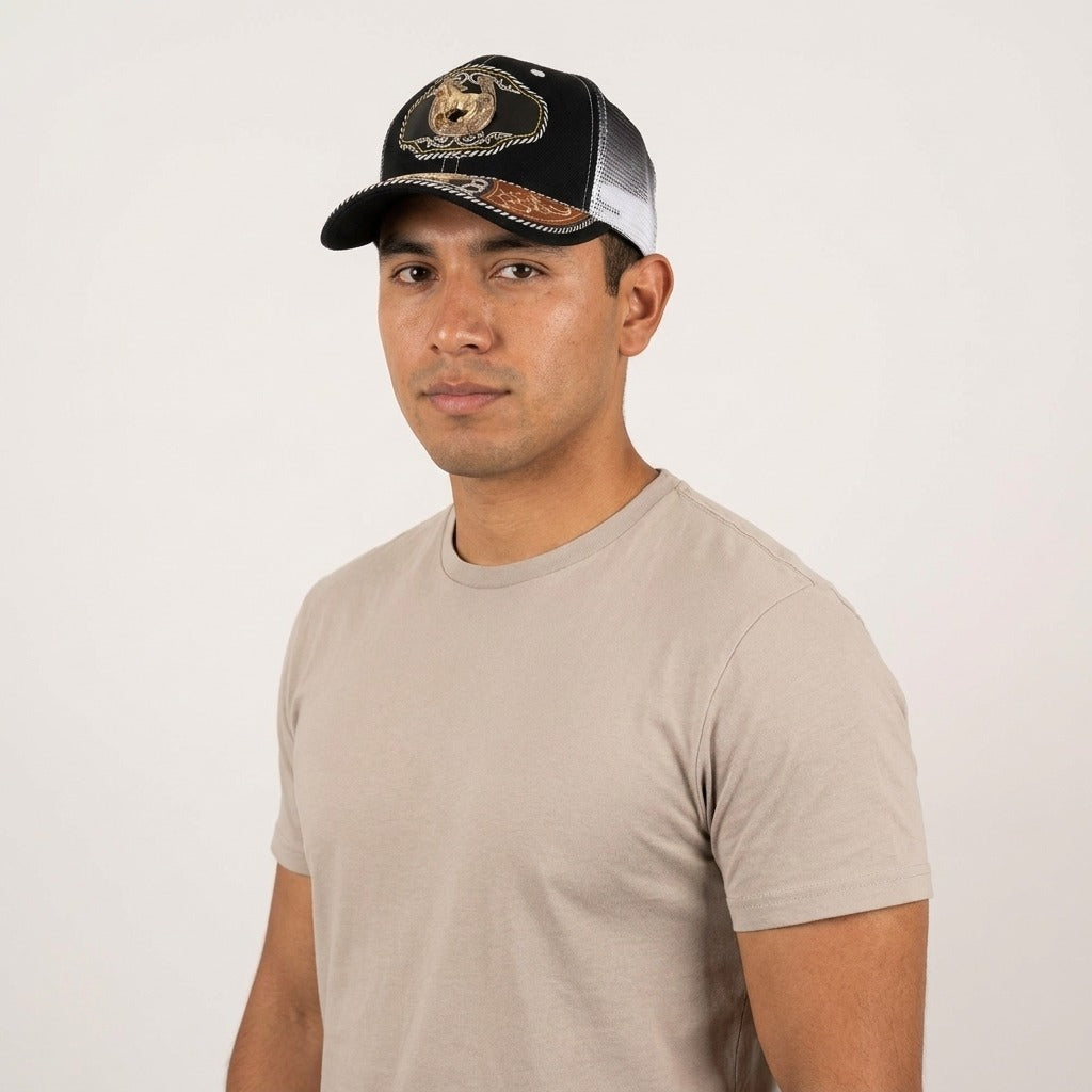 Model wearing the black charro cap with gold horse and horseshoe emblem