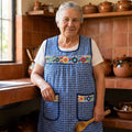 Woman wearing the blue gingham embroidered Mexican apron in a traditional kitchen