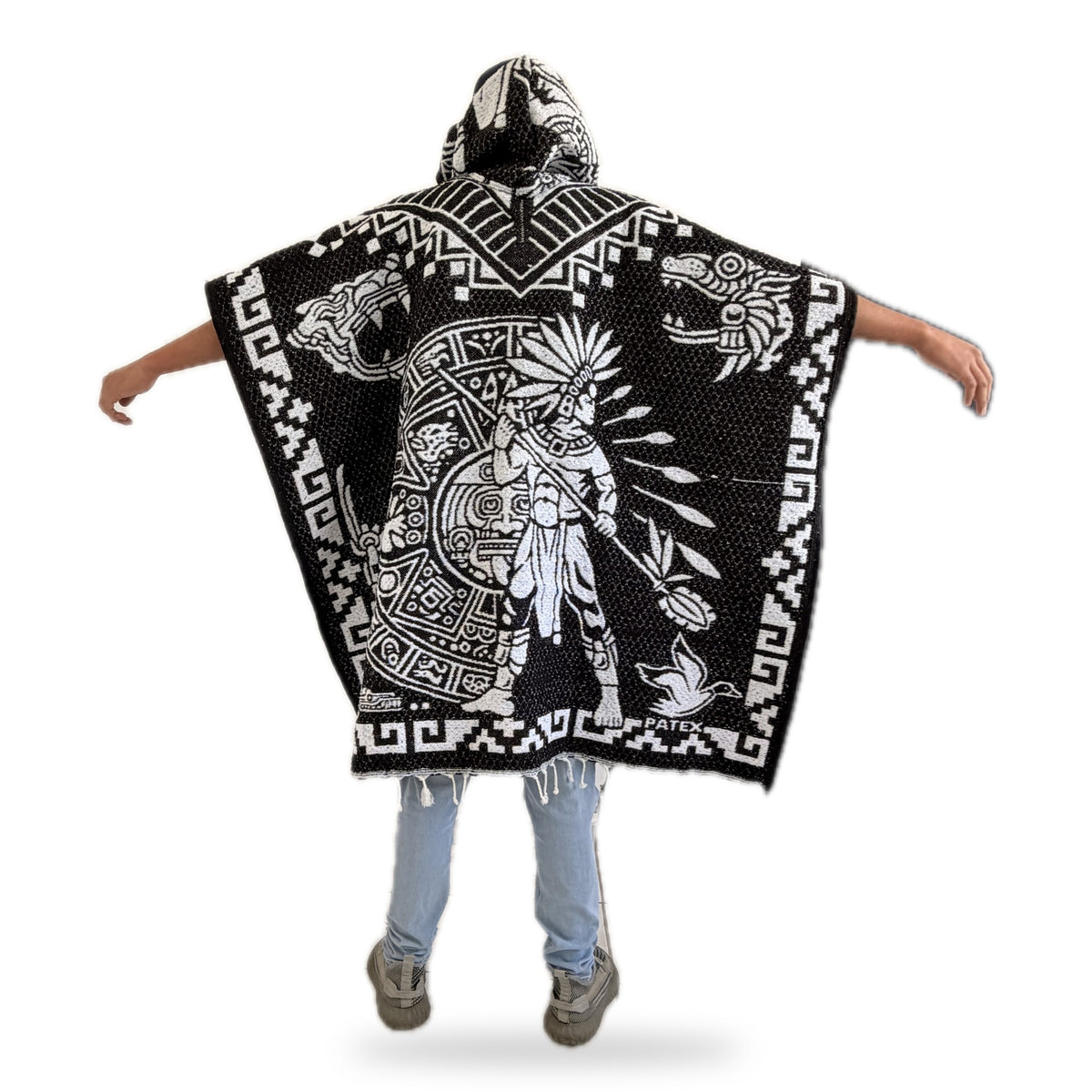 Back of the Aztec poncho: warrior in a feathered headdress with a Sun Stone shield
