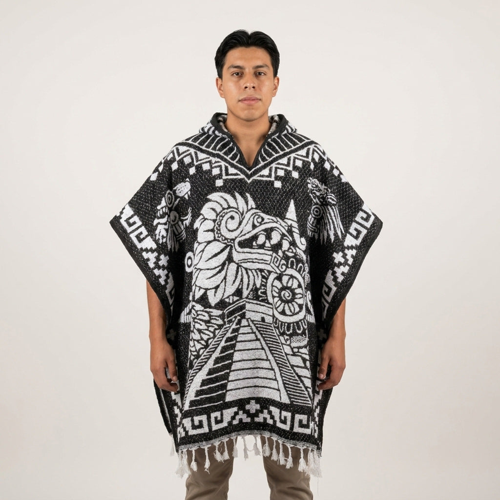 Model wearing the Aztec Calendar hooded Mexican poncho in black and white, studio front view